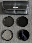 Nikon 67MM Lens Kit W/case Includes Uv, ND4, ND8, Wide C-p-l Filters. Fixed Price $36.99.