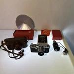 Leica Iic 35MM Camera W/ Elmar 50MM F/3.5 + Leitz Flash, Meter, Case & Box. Fixed Price $895.00.