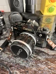 Canon A-1 Film Camera With 55MM 1.2 35-70MM Filters Flash Cases Lenses Timer. Fixed Price $350.00.
