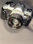 Promaster 2500PK Super Silver Slr Film Camera W/ 50MM Lens Case. Fixed Price $70.00.