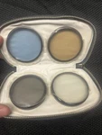 Assortment Kenko Filters (55MM) And Cases. Fixed Price $30.00.