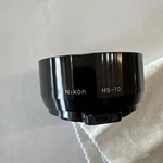 Nikon HS-10 Clip-on Hood, Excellent Conditionfor 85MM F2, 105MM F2.5 Lenses. Fixed Price $15.00.